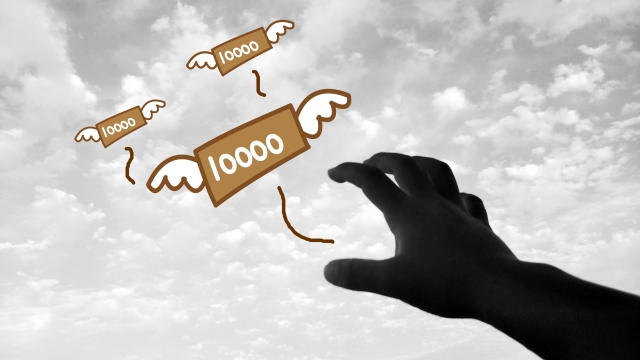 お金の上でうなだれる。北杜市で借金返済の無料相談をする